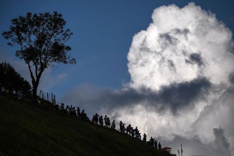 Spectators gather on a slope on July 25.