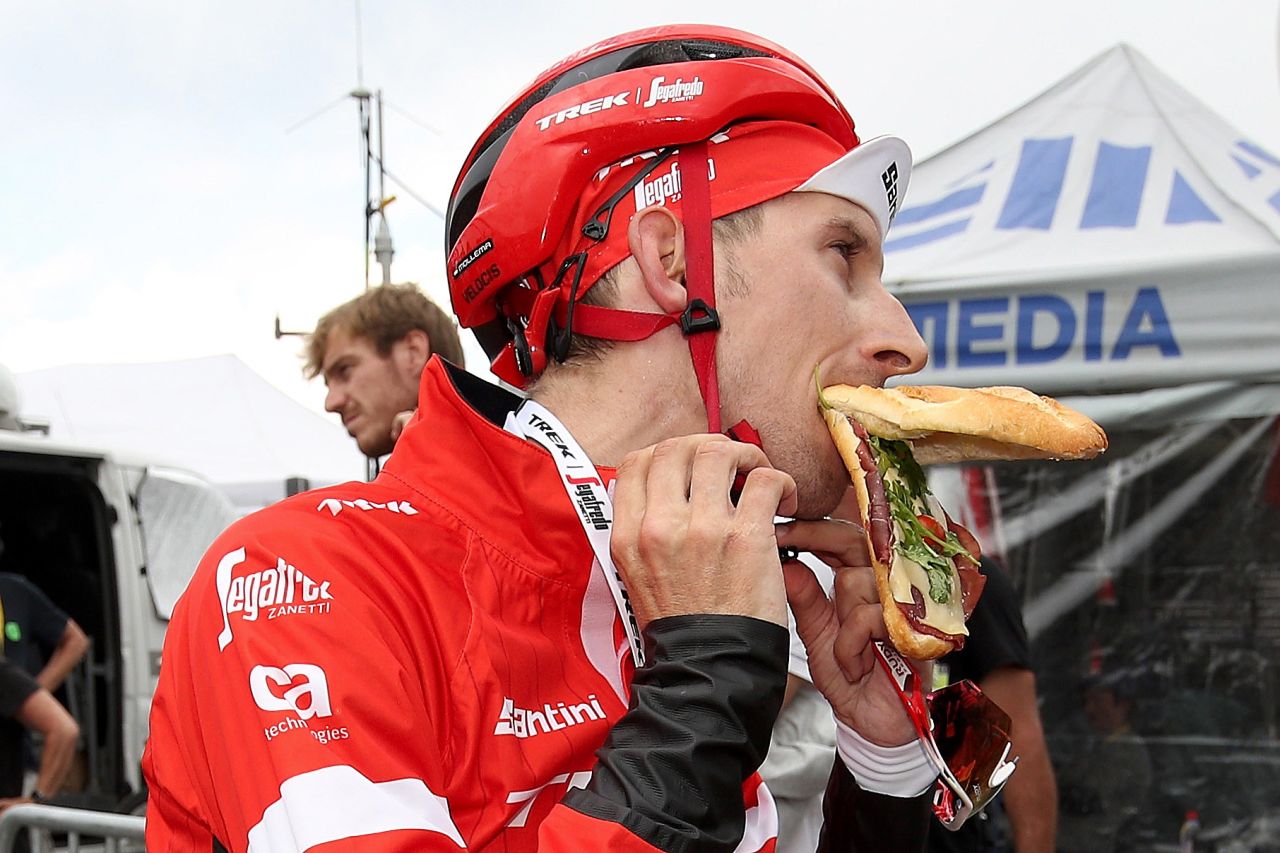 Dutch cyclist Bauke Mollema devours a sandwich after finishing the 17th stage.