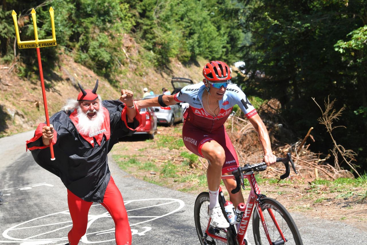 Germany's Nils Politt passes an exuberant fan during the 11th stage on July 18.