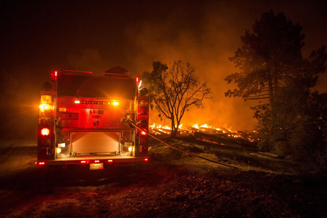 A fire engine sits on the frontlines of the Cranston Fire, which has grown to 4,700 acres and is only 5% contained. 