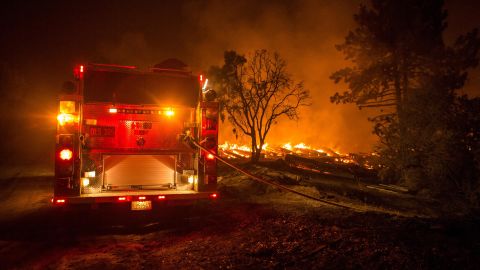 A fire engine sits on the frontlines of the Cranston Fire, which has grown to 4,700 acres and is only 5% contained.