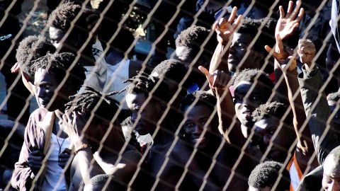 Several migrants celebrate in Ceuta after they managed to breach the border fence between Spain and Morocco.