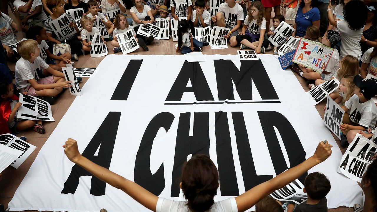 Protesters and their children participate in a sit-in in the Hart Senate Office Building to mark the court-ordered deadline for the Trump Administration to reunify thousands of families separated at the border July 26, 2018 in Washington, DC. (Win McNamee/Getty Images)
