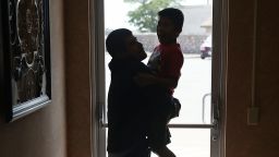 EL PASO, TX - JULY 25:  A man, identified only as Emiliano, spends time with his son, Hermy, 8, as they are cared for in an Annunciation House facility after they were reunited with each other on July 25, 2018 in El Paso, Texas. Emiliano and Hermy, originally from Guatemala, were reunited at an I.C.E processing center about two months after the two were separated when they tried to cross into the United States. It is unclear if a court-ordered July 26th deadline will be met for the U.S. government to reunite as many as 2,551 migrant children ages 5 to 17 that had been separated from their families.  (Photo by Joe Raedle/Getty Images)