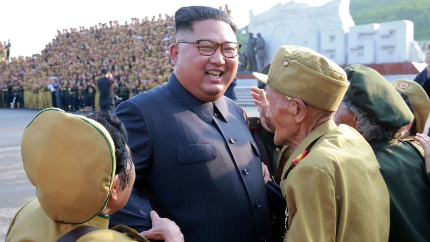In this July 26, 2018, photo, provided on July 27, by the North Korean government, North Korean leader Kim Jong Un, center, is greeted by the participants of a war veterans' meeting,  on the 65th anniversary of the signing of the ceasefire armistice that ends the fighting in the Korean War, in Pyongyang.  Independent journalists were not given access to cover the event depicted in this image distributed by the North Korean government. The content of this image is as provided and cannot be independently verified. Korean language watermark on image as provided by source reads: "KCNA" which is the abbreviation for Korean Central News Agency. (Korean Central News Agency/Korea News Service via AP)