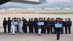 PYEONGTAEK, SOUTH KOREA - JULY 27: U.N. honor guards carry small boxes containing remains believed to be from American servicemen killed during the 1950-53 Korean War after arrived from North Korea, at Osan Air Base on July 27, 2018 in Pyeongtaek, South Korea. (Photo by Ahn Young-joon - Pool/Getty Images)