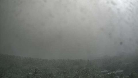 A shot from a government-run camera on Ambae shows the sky almost completely obscured by falling ash.