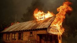 An historic schoolhouse burns as the Carr Fire tears through Shasta, Calif., Thursday, July 26, 2018. Fueled by high temperatures, wind and low humidity, the blaze destroyed multiple homes and at least one historic building. (AP Photo/Noah Berger)