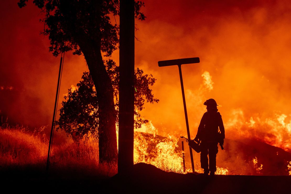 A firefighter battles the Carr fire in Redding, California.