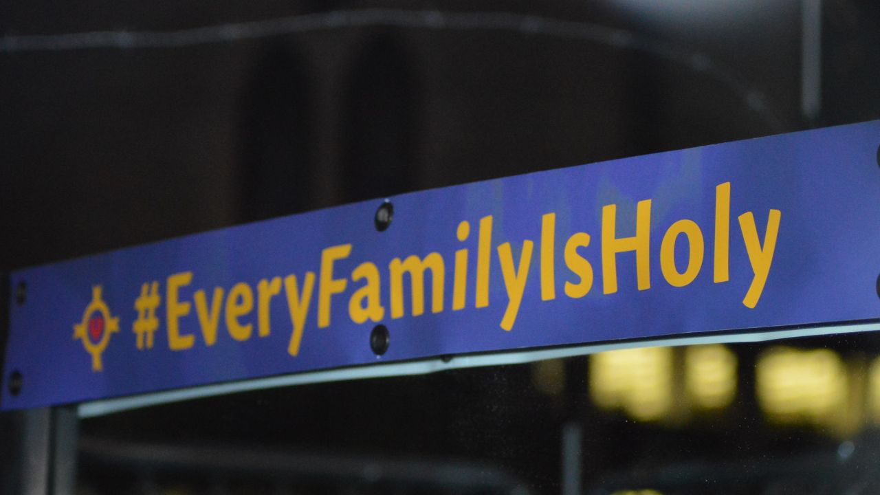 A sign on a mirror outside the Christ Church Cathedral is part of the church's "Every Family is Holy" campaign.
