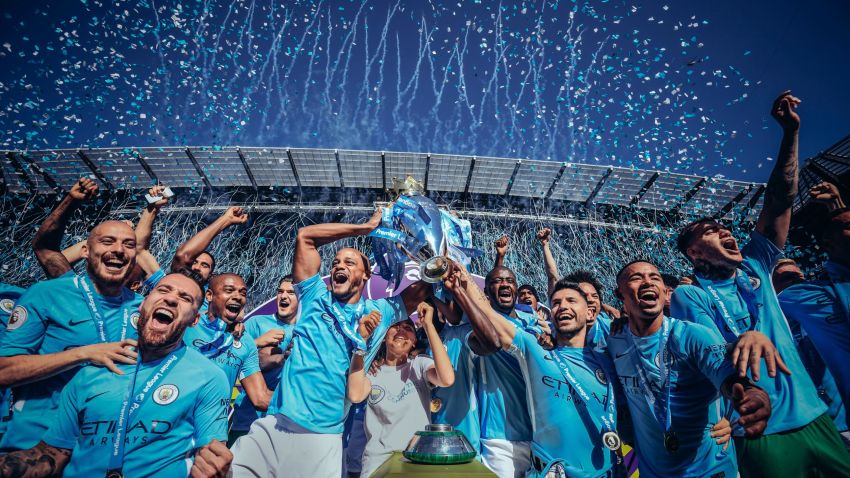 MANCHESTER, ENGLAND - MAY 06: [Editor's note - digital filters were used in the creation of this image] Vincent Kompany and Sergio Aguero of Manchester City lift the Premier League trophy during the Premier League match between Manchester City and Huddersfield Town at Etihad Stadium on May 6, 2018 in Manchester, England.  (Photo by Michael Regan/Getty Images)