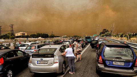 Cars are blocked after a wildfire caused a road closure in Kineta in  Greece on July 23.