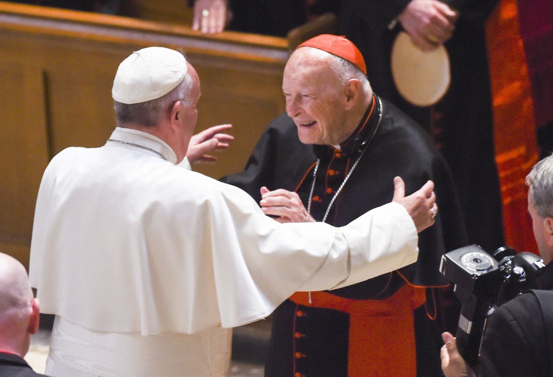 Theodore McCarrick, center, greets Pope Francis in 2015 at the Cathedral of St. Matthew in Washington.