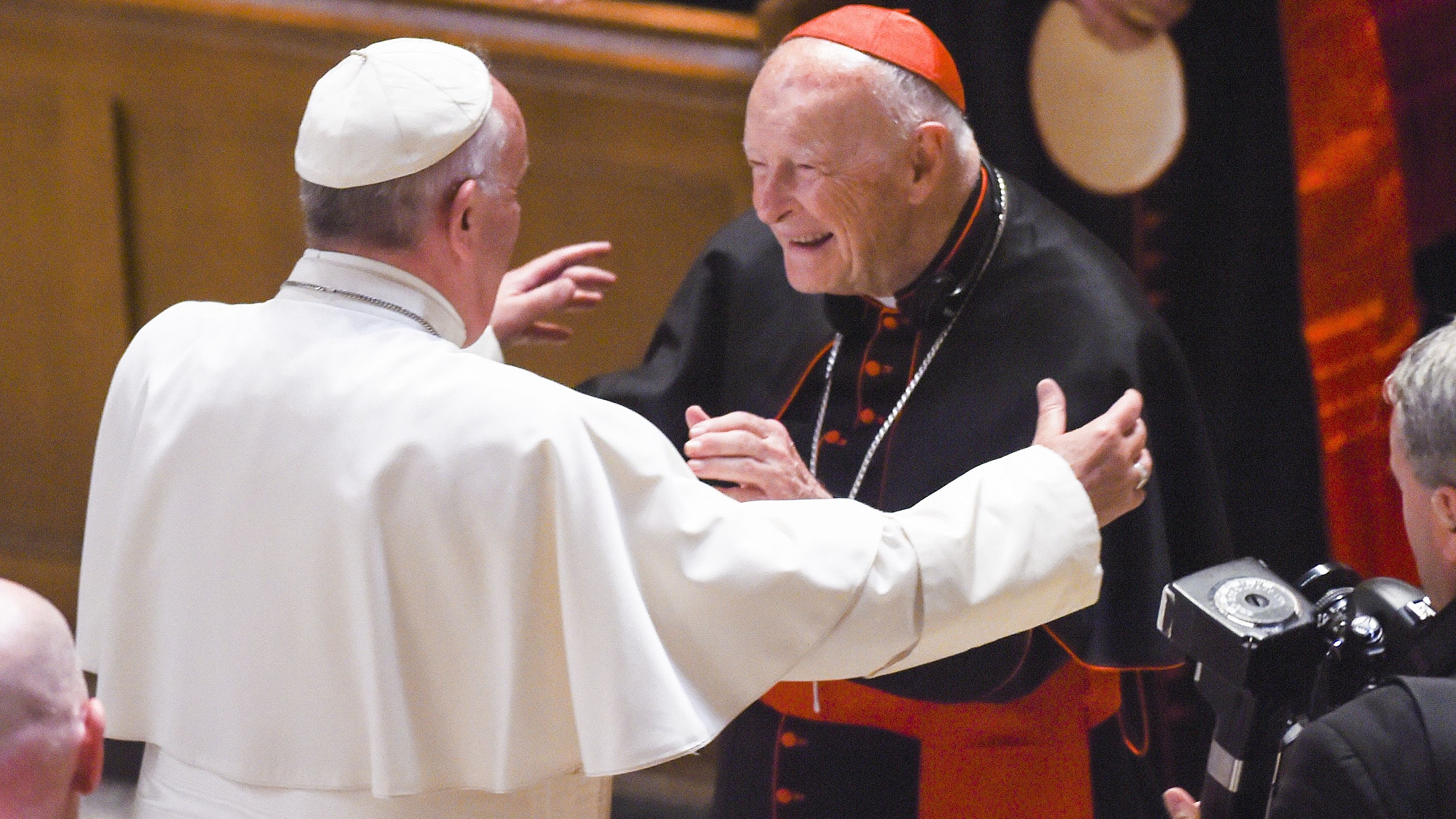 Theodore McCarrick, center, greets Pope Francis in 2015 at the Cathedral of St. Matthew in Washington