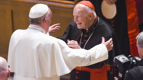 Theodore McCarrick, center, greets Pope Francis in 2015 at the Cathedral of St. Matthew in Washington.