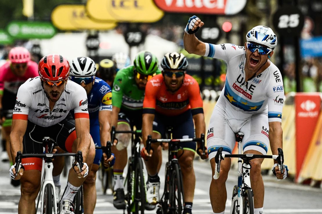 Norway's Alexander Kristoff celebrates as he crosses the finish line to win the 21st and last stage of the 105th edition of the Tour de France cycling race between Houilles and Paris Champs-Elysees.