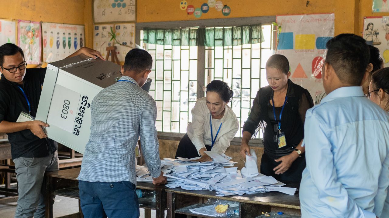 Voting officials in Cambodia count ballots Sunday.