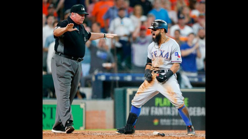 Rougned Odor of the Texas Rangers celebrates after hitting an inside the park home run in the fifth inning against the Houston Astros at Minute Maid Park on Saturday, July 28, in Houston.  