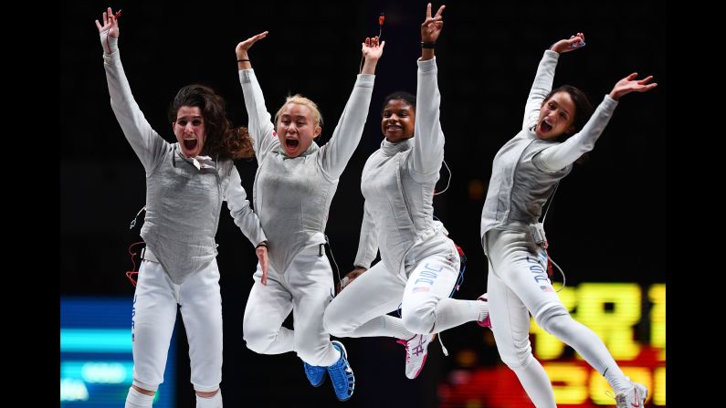 Lee Kiefer, right, of the United States, celebrates with her team after defeating Alice Volpi in the women's foil team competition final at the 2018 World Fencing Championships in Wuxi in China's eastern Jiangsu province on Thursday, July 26. 