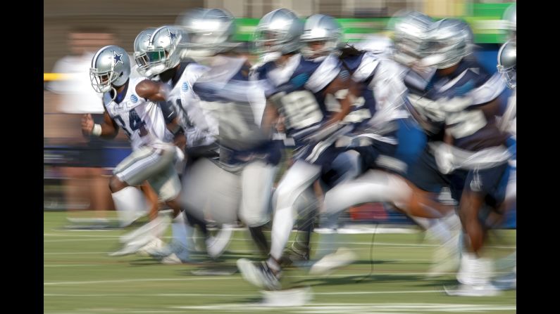 Dallas Cowboys players run sprints during NFL football training camp on Friday, July 27, in Oxnard, California. 