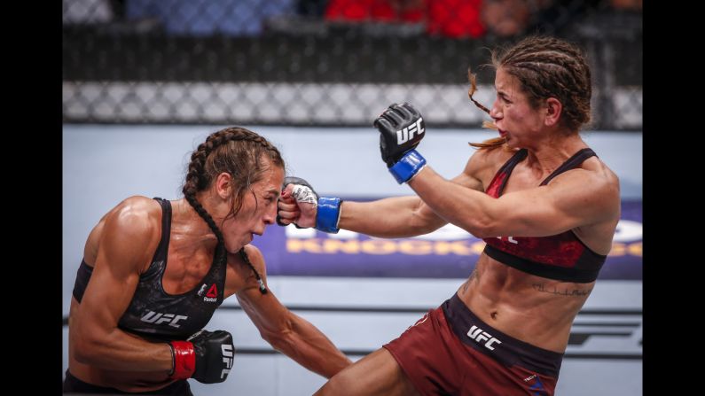 Joanna Jedrzejczyk, left, and Tecia Torres fight during a women's strawweight mixed martial arts bout at UFC Fight Night in Calgary, Alberta, on Saturday, July 28.