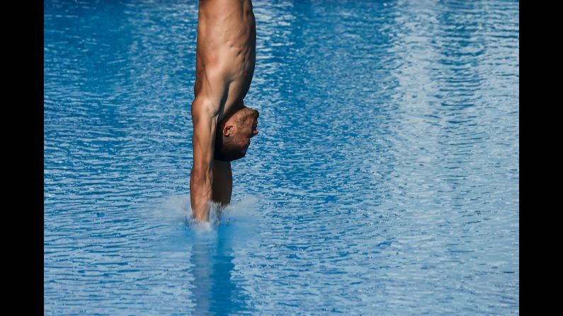 Dominican Frandiel Gomez competes in the men's diving 10 meter platform final event during the 2018 Central American and Caribbean Games in Barranquilla, Colombia, on Tuesday, July 24. Mexico's Ivan Garcia won the gold medal, Mexico's Andres Villareal the silver medal and Colombia's Sebastian Villa the bronze medal in this event. 