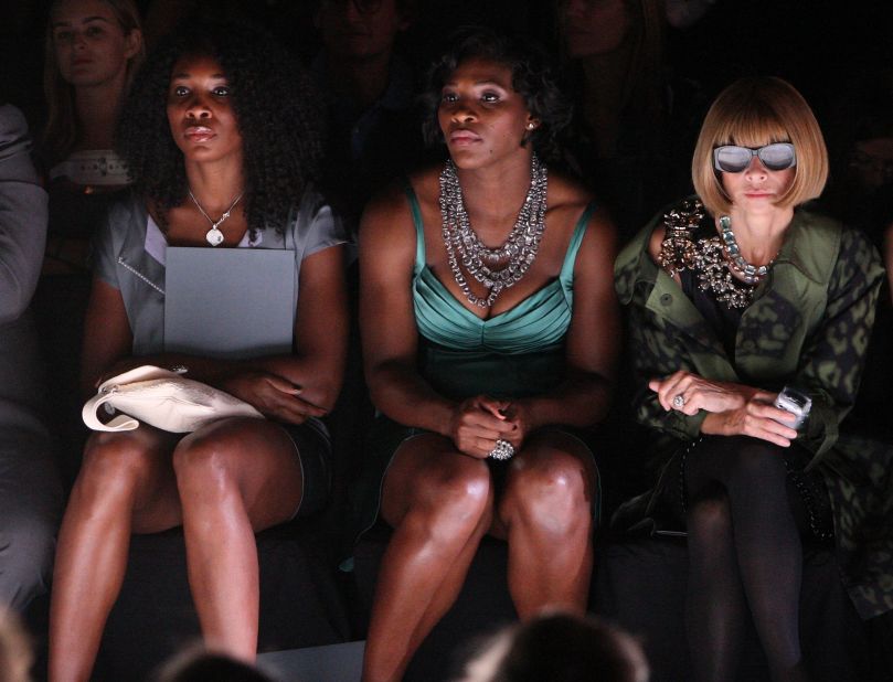 Tennis players Venus Williams (far left) and Serena Williams seated alongside Wintour at the Zac Posen Spring-Summer 2009 fashion show during during New York Fashion Week. 