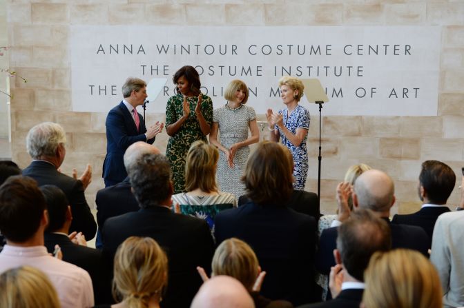 First lady Michelle Obama applauds after she cut a ribbon to officially open the Costume Institute's Anna Wintour Costume Center at the Metropolitan Museum of Art on May 5, 2014.