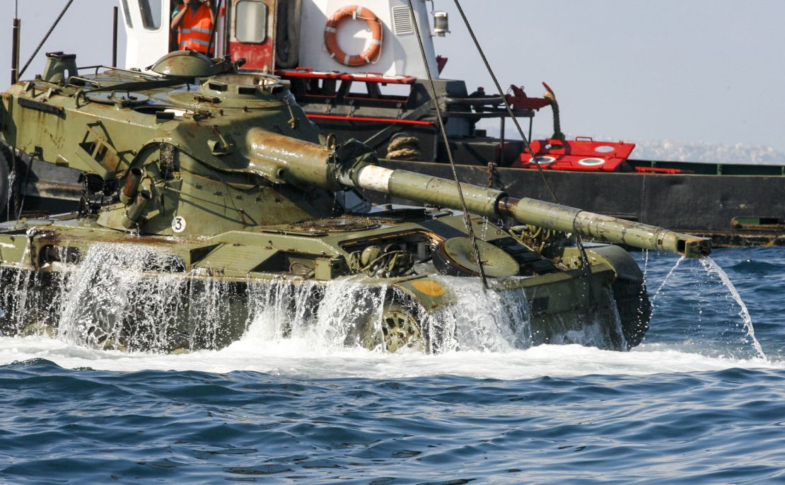 A tank is dropped into the Mediterranean Sea for the park project.