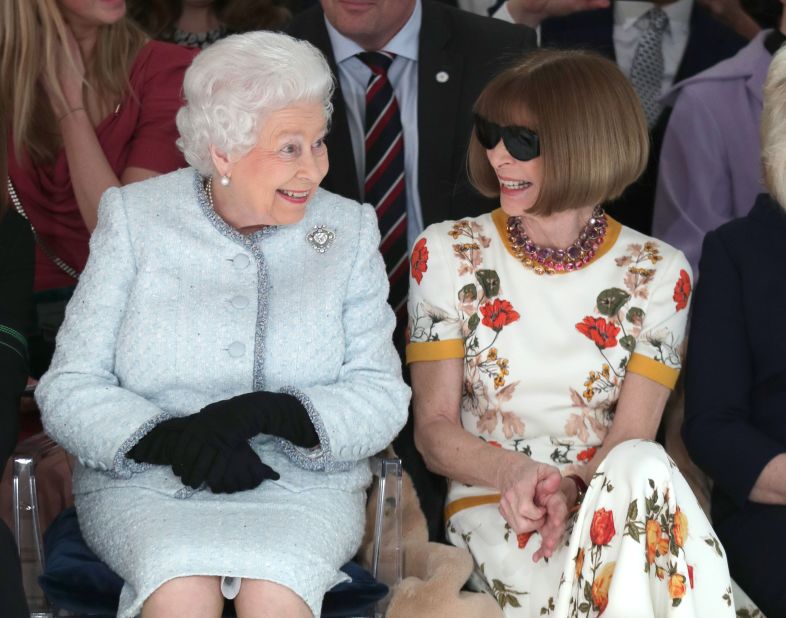 Queen Elizabeth II and Anna Wintour seated together at Richard Quinn's fashion show in London in February 2018.