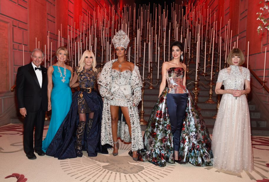 Stephen Schwarzman, Christine Schwarzman, Donatella Versace, Rihanna, Amal Clooney and Anna Wintour pose together at the "Heavenly Bodies: Fashion & The Catholic Imagination" Costume Institute Gala at The Metropolitan Museum of Art on May 7, 2018, in New York City.