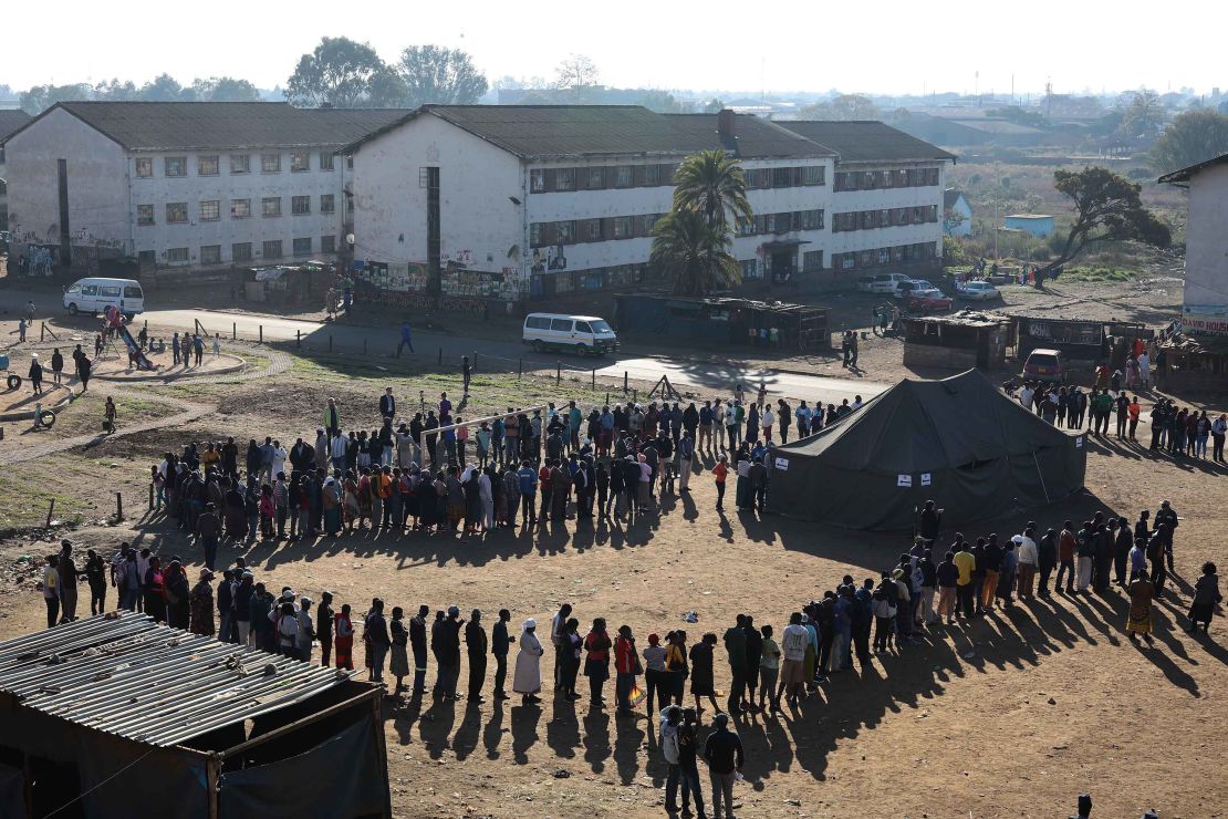 Voters queue at a polling station in Harare.