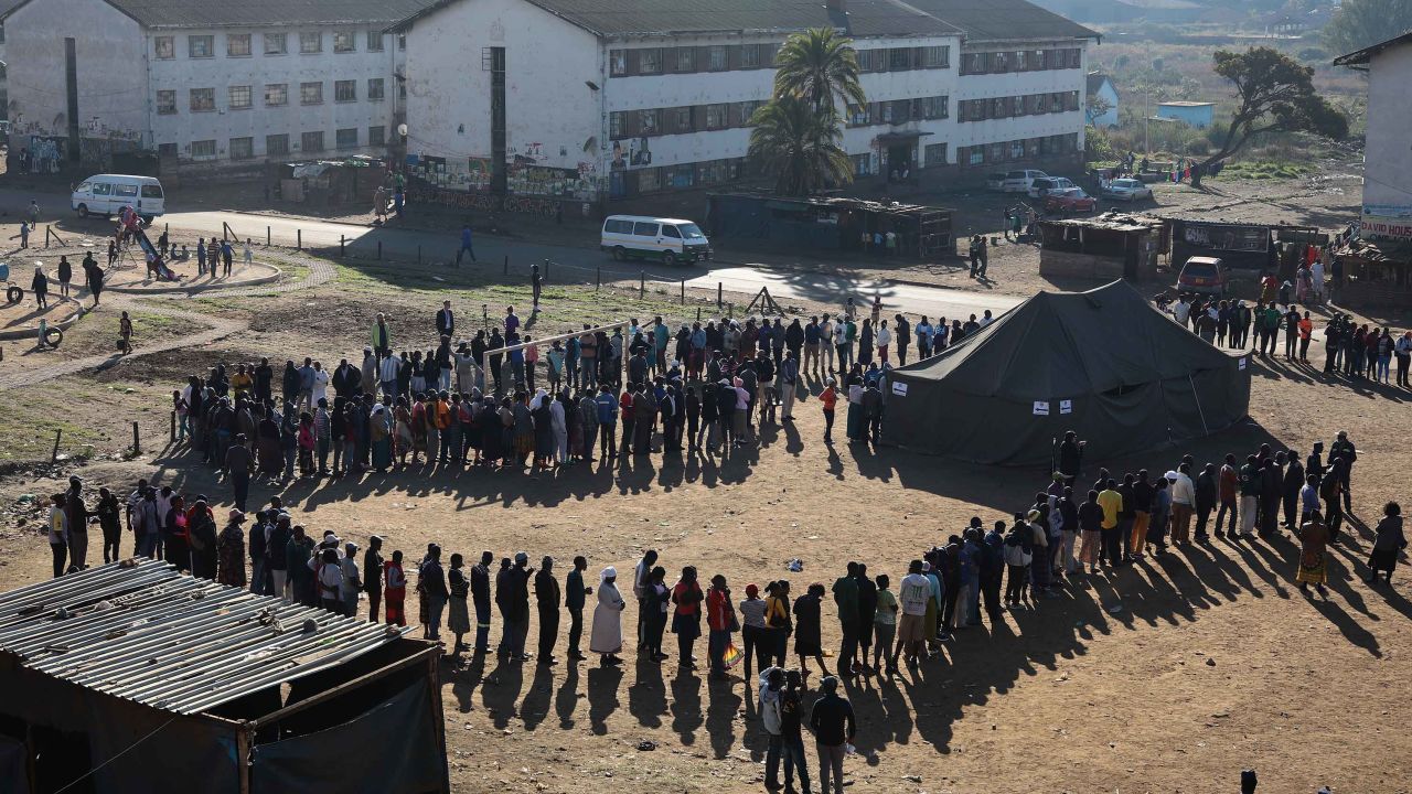 Voters queue at a polling station in Harare.