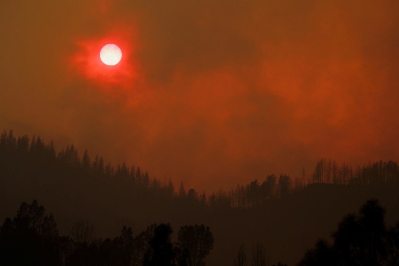 The setting sun is turned red by smoke from the Carr Fire on Friday, July 27.