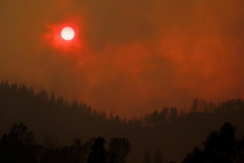 The setting sun is turned red by smoke from the Carr Fire on Friday, July 27.