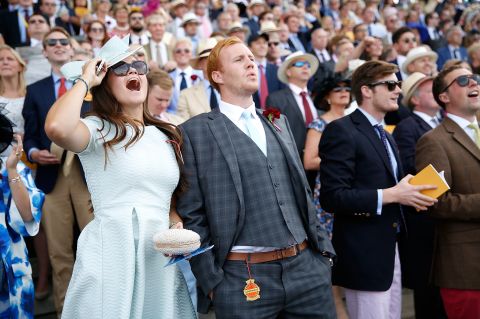 Racegoers take in the drama of the Qatar Goodwood Festival, commonly known as "Glorious Goodwood." 