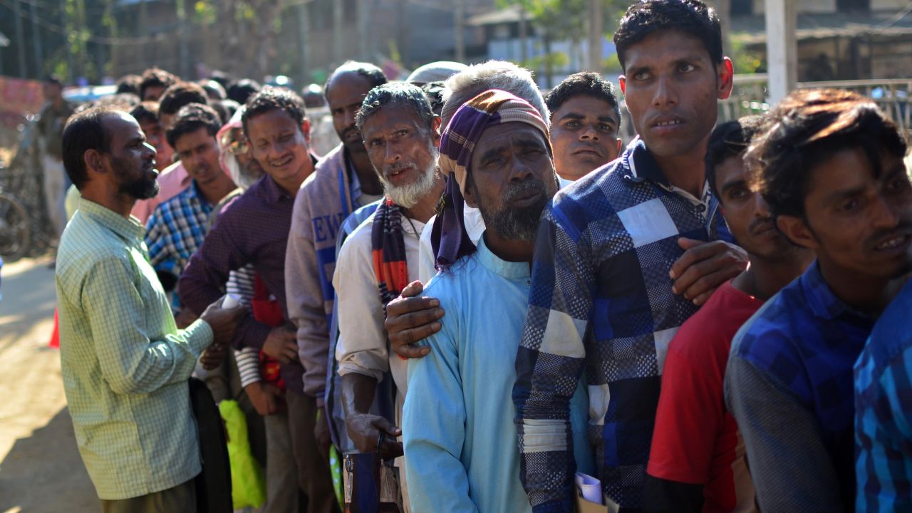 Assam is the only state in India to have a citizenship register. Villagers in Assam stand in line to check their names on the first draft of NRC in 2018.