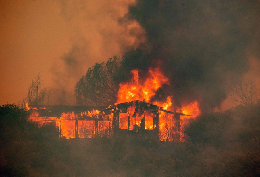 A house near Finley burns from the Mendocino Complex Fire on July 30.