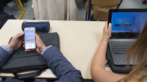 High school students with their smartphones and tablet computers at the vocational school in Bischwiller, eastern France.   