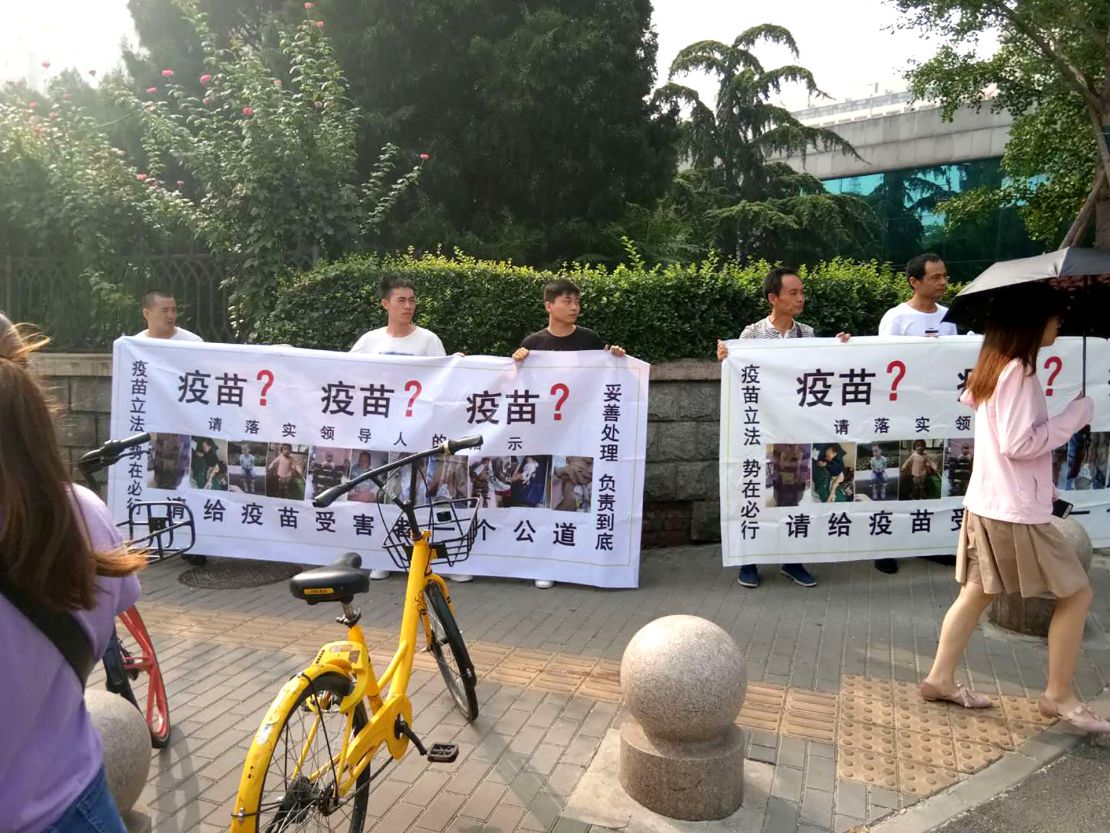 Small group of protestors hold a rare public demonstration for a second day over the vaccine scandal in front of China's Food and Drug Administration in Beijing on Tuesday July 31.