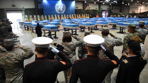US soldiers salute during a repatriation ceremony for the remains of US soldiers who were killed in the Korean War and collected in North Korea, at Osan Air Base in Pyeongtaek on August 1, 2018.