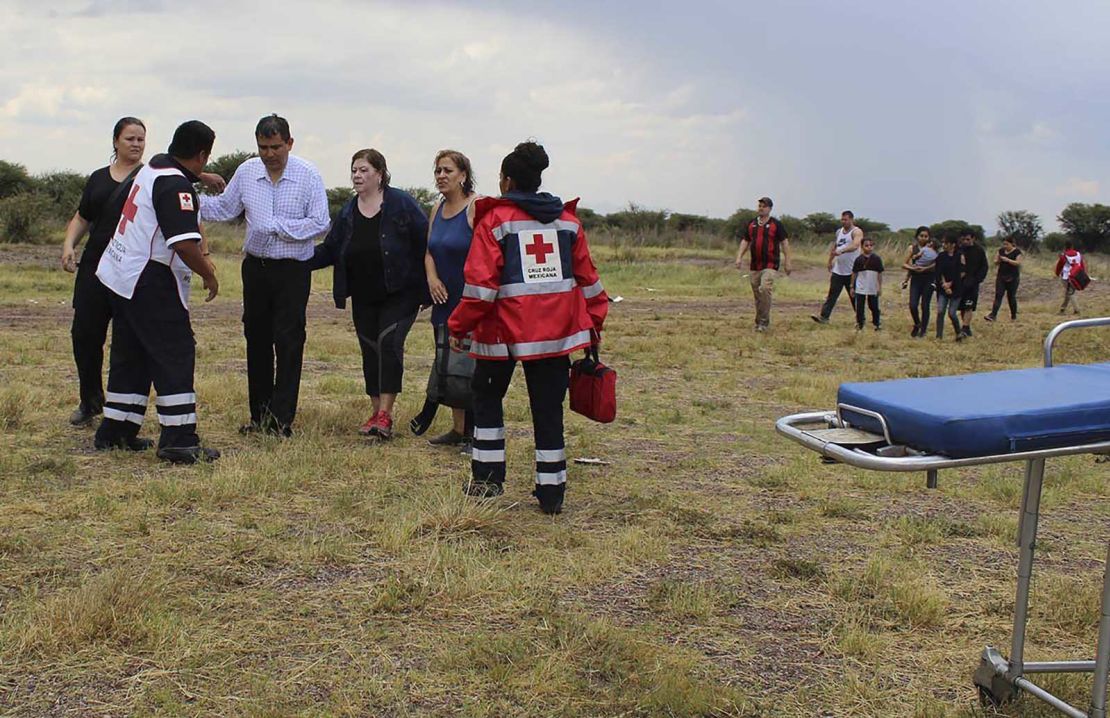 Red Cross workers tend to survivors of the plane crash Tuesday.
