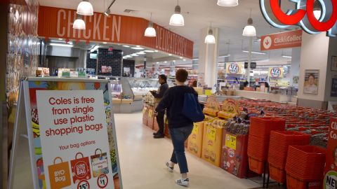 A sign, seen in a Coles supermarket in Sydney, advises its customers of its plastic bag-free policy on July 2.