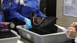  A Transportation Security Administration (TSA) worker screens luggage at LaGuardia Airport (LGA) on September 26, 2017 in New York City. 