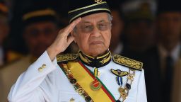 Malaysia's Prime Minister Mahathir Mohamad salutes the royal guard of honour during the opening ceremony of the parliament in Kuala Lumpur on July 17, 2018. (Photo by Mohd RASFAN / AFP)        (Photo credit should read MOHD RASFAN/AFP/Getty Images)
