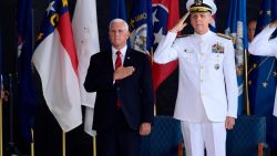 Vice President Mike Pence attends a ceremony wit Commander of U.S. Indo-Pacific Command Adm. Phil Davidson marking the arrival of the remains believed to be of American service members who fell in the Korean War at Joint Base Pearl Harbor-Hickam, Hawaii, Wednesday, Aug. 1, 2018. (AP Photo/Susan Walsh)