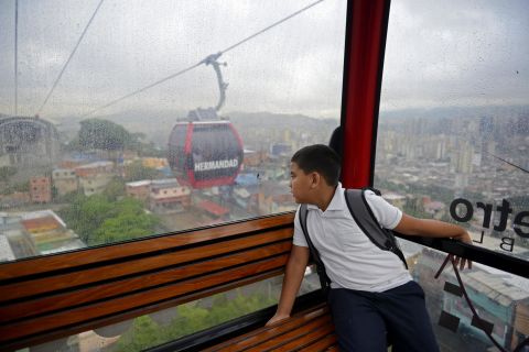 Leobardo Medina, 8, rides a gondola lift to school in Caracas, Venezuela. 