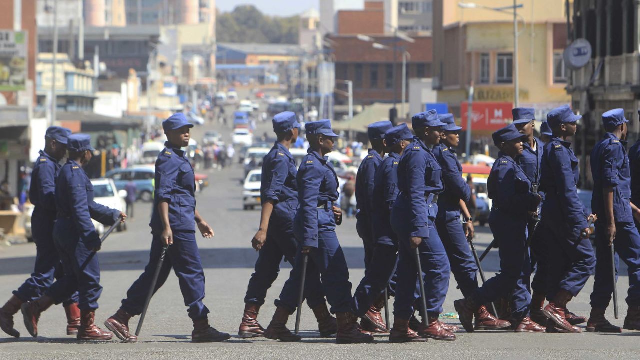 Zimbabwe police patrol the streets of Harare on Thursday.