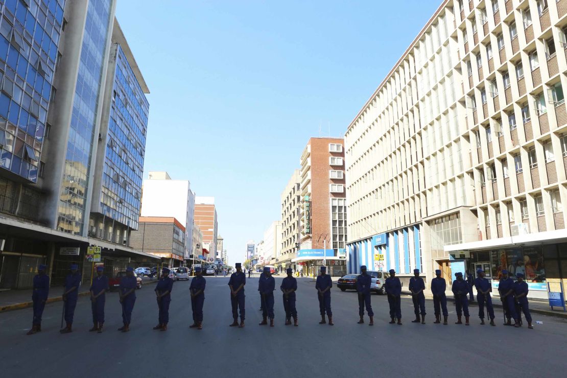 Police block a road leading to the opposition offices Thursday in Harare.