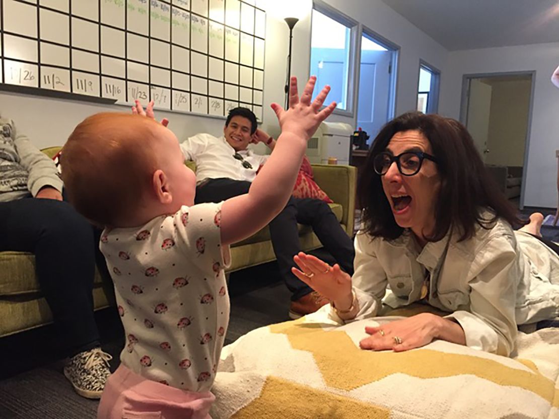 Aline Brosh McKenna plays with one of her staff writer's infants at the production offices for 'Crazy Ex Girlfriend.'